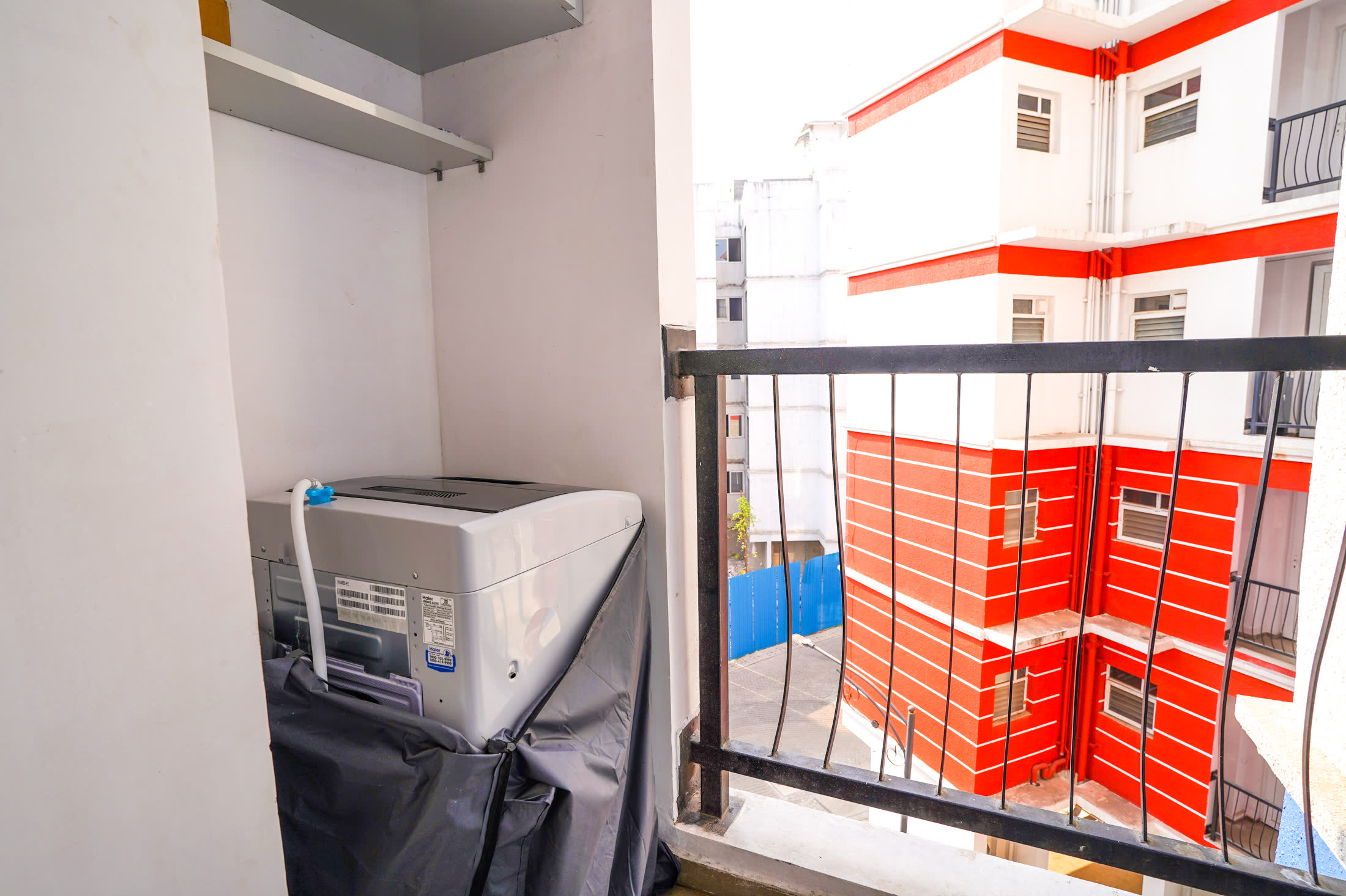 Apartment balcony with colourful building view