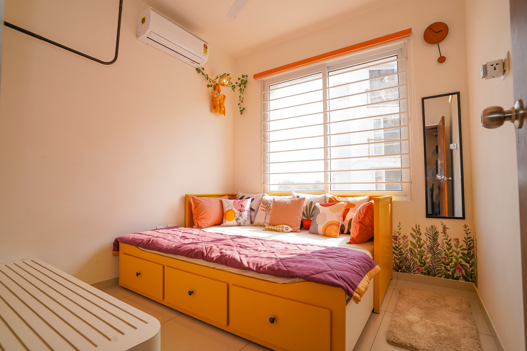Bedroom with coral bedding and warm details