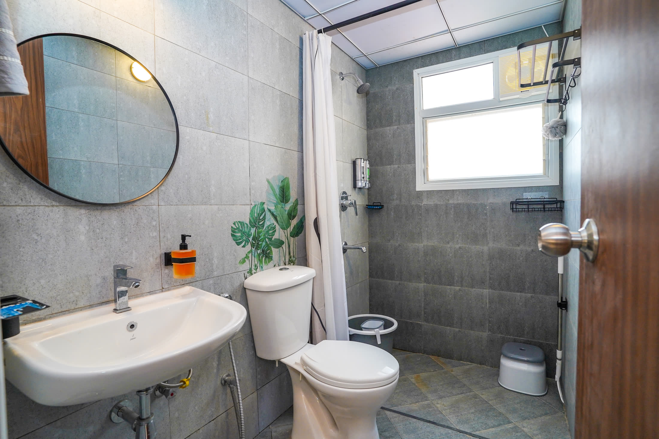 Common washroom with grey stone finish